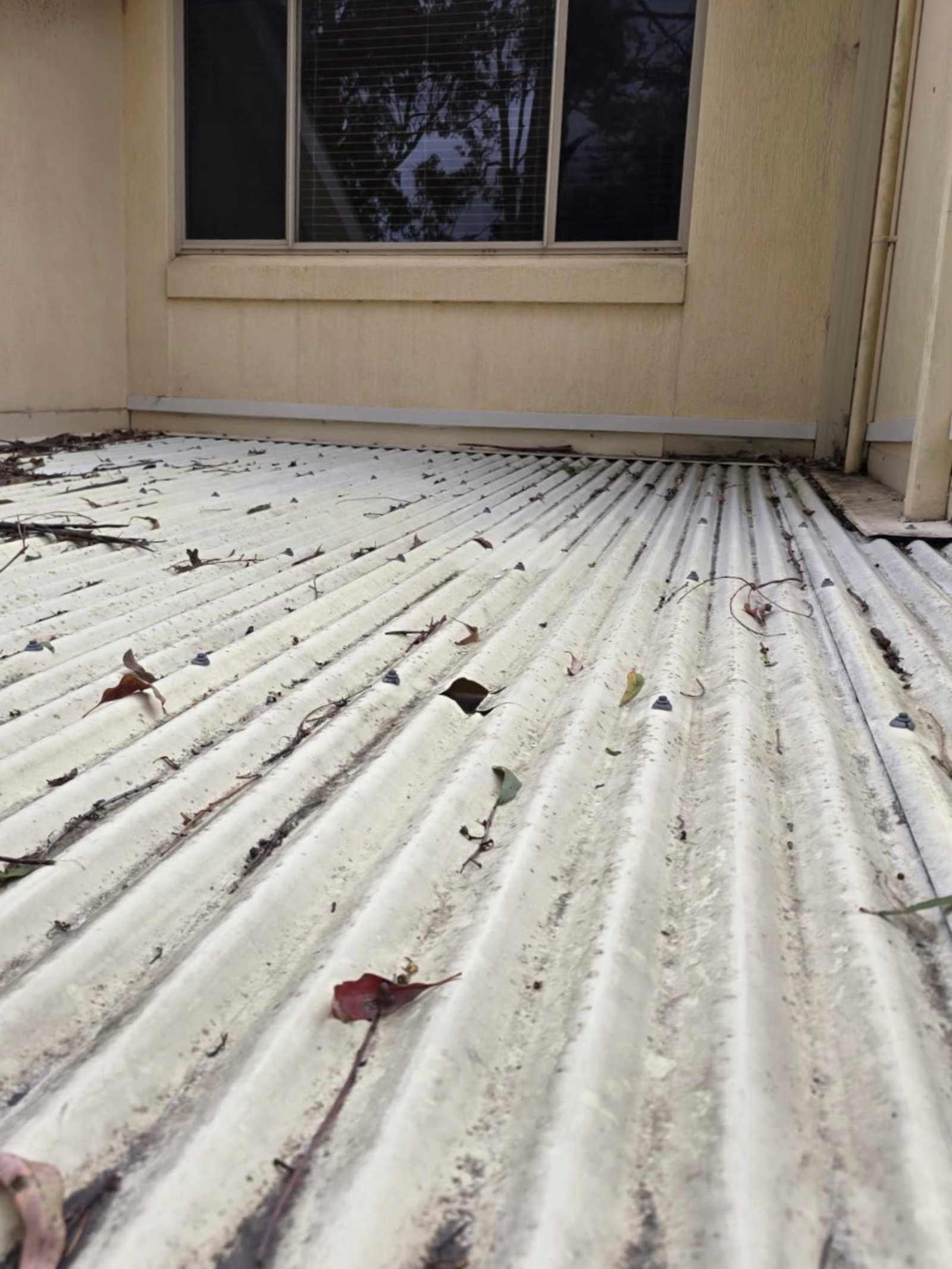Before: old polycarbonate roofing